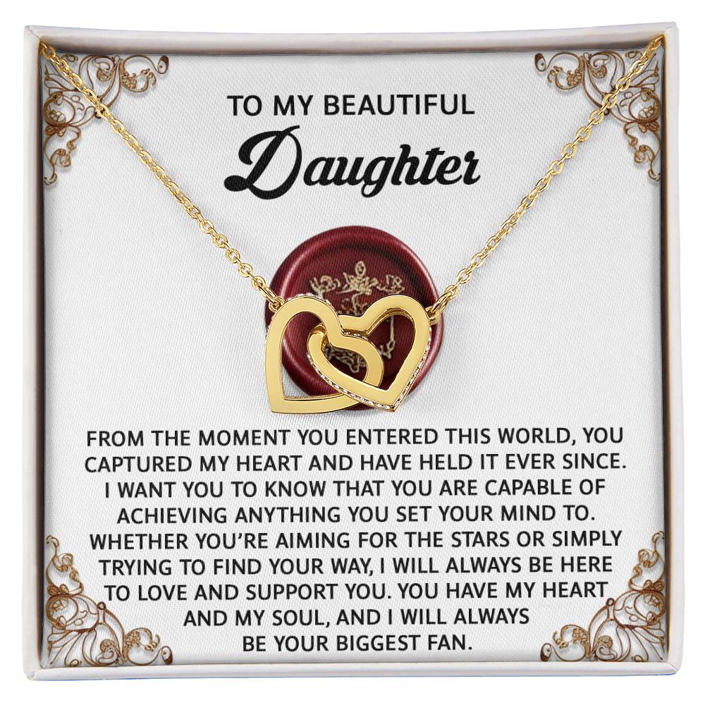 The Daughter-Biggest Fan Interlocking Hearts Necklace, featuring cubic zirconia crystals, comes with a heartfelt message card for your daughter.