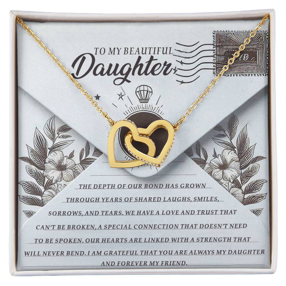 The Daughter-My Friend - Interlocking Hearts Necklace in rose gold finish shines elegantly on a floral card with heartfelt words about love, memories, and trust for a daughter. The presentation is completed with an envelope motif.