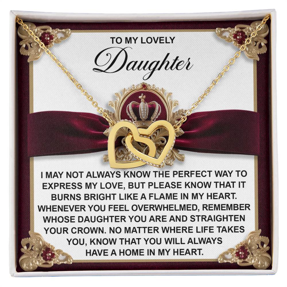 The Daughter-A Flame Interlocking Hearts Necklace features gold hearts on a card. The message reads: "To my lovely daughter... you will always have a home in my heart." Adorned with cubic zirconia and elegantly presented in a red and gold gift box.