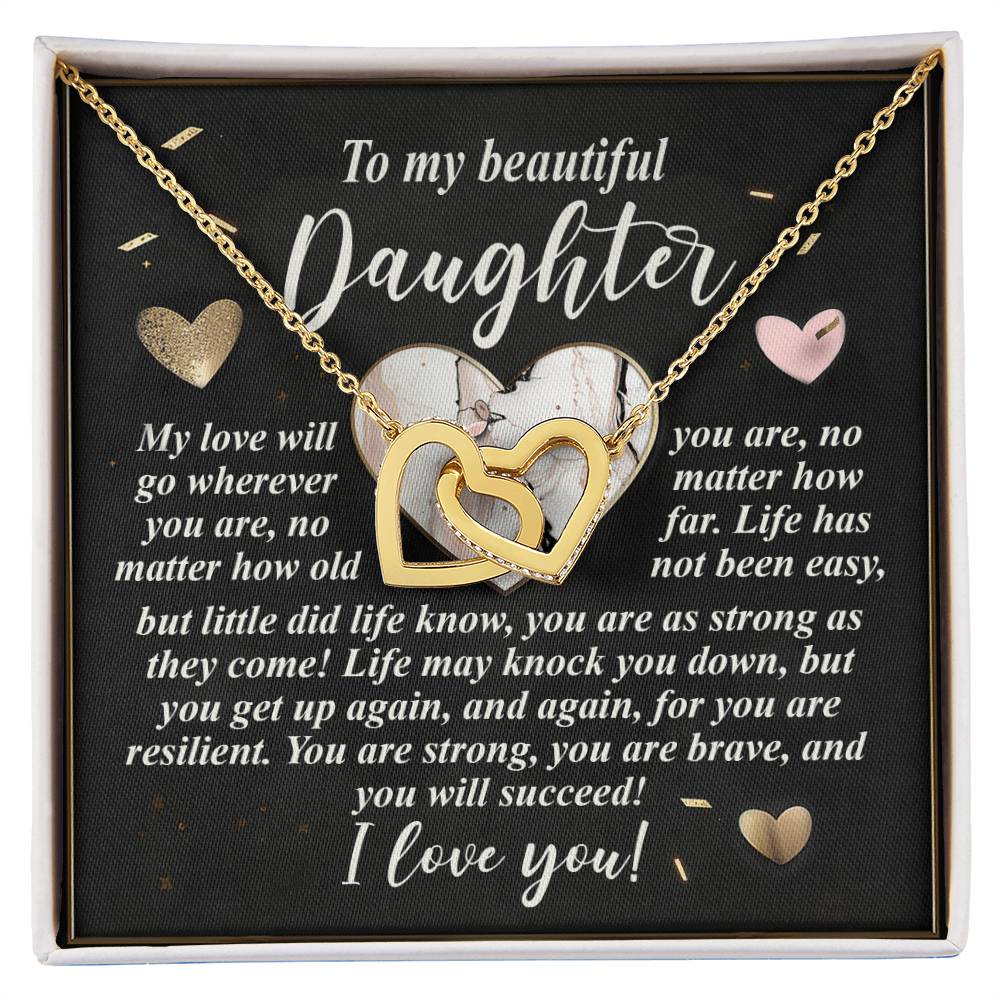 The "Daughter-Your Strength" Interlocking Hearts Necklace features a beautiful rose gold finish with a gold heart design. It comes in a box with an inspiring message for daughters and is set against a shimmering background adorned with small gold heart accents.