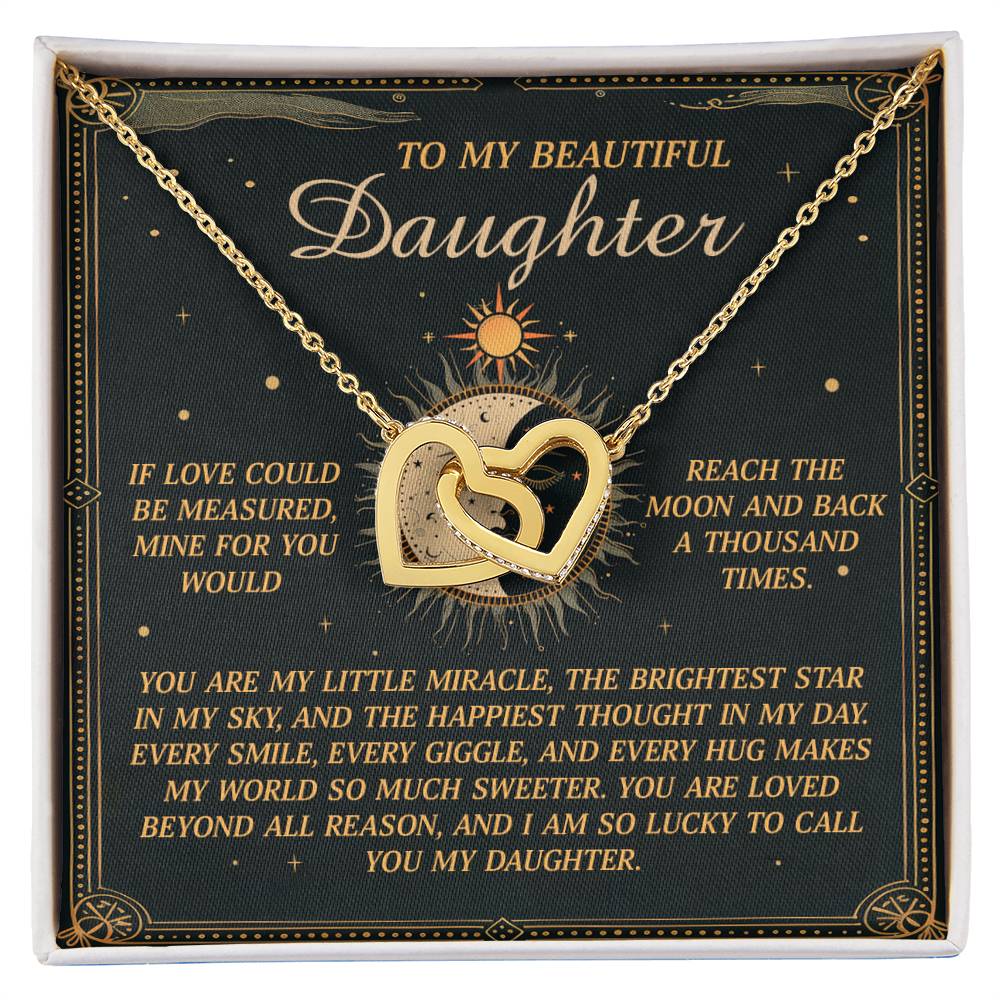 Inside the jewelry box, a Daughter-To Call You - Interlocking Hearts Necklace gleams with a rose gold finish and cubic zirconia crystals. The card reads: "To my beautiful daughter… If love could be measured, mine for you would reach the moon and back a thousand times….