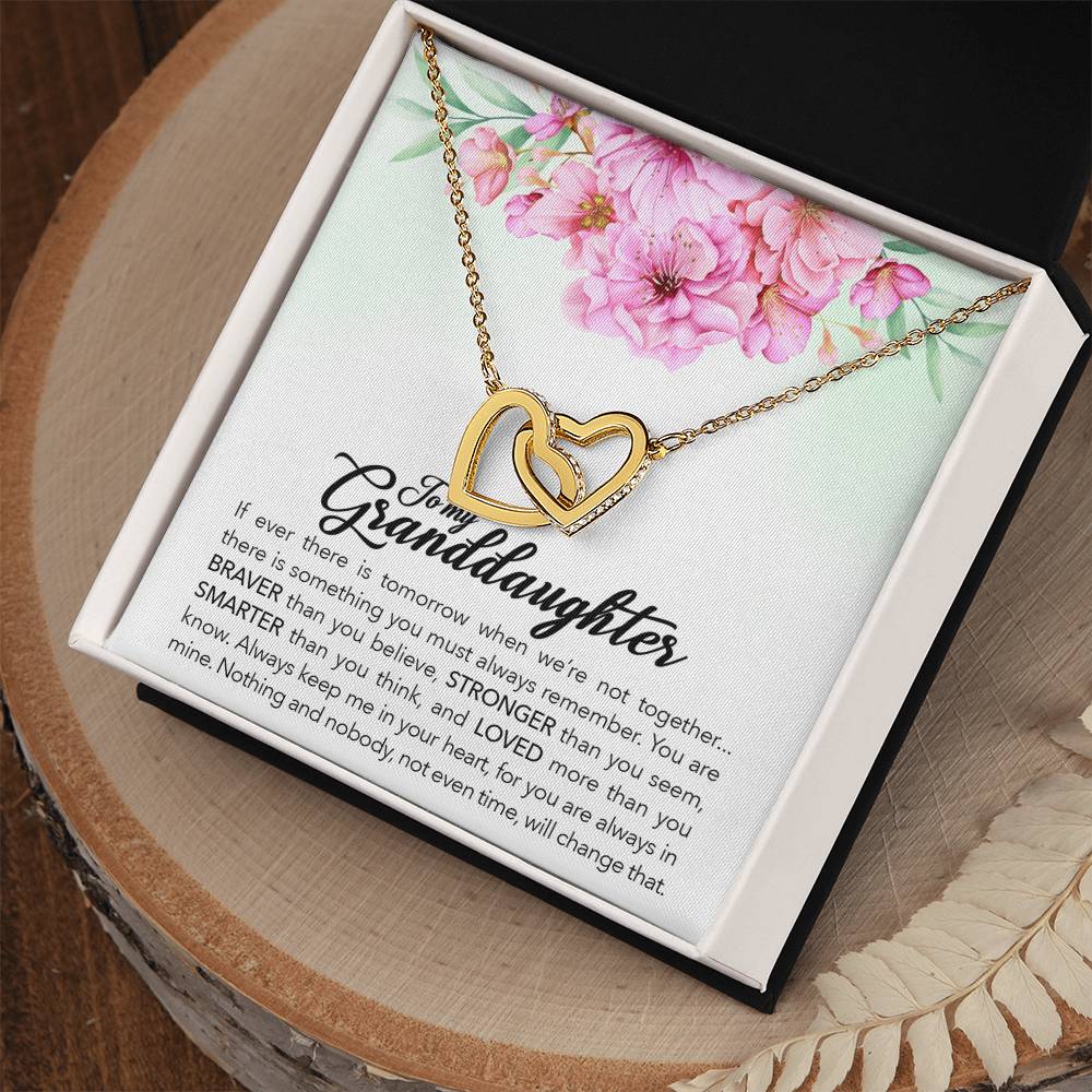 An To My Granddaughter, Always Keep Me In Your Heart interlocking hearts necklace with the word "granddaughter" inscribed on it, presented in a box with a sentimental message for encouragement and love from ShineOn Fulfillment.