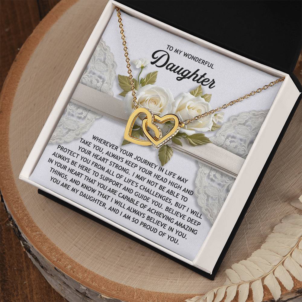 The Daughter-Your Heart Interlocking Hearts Necklace features a rose gold finish, cubic zirconia crystals, and comes nestled in a box adorned with elegant floral and lace designs and an inspirational message for your daughter.