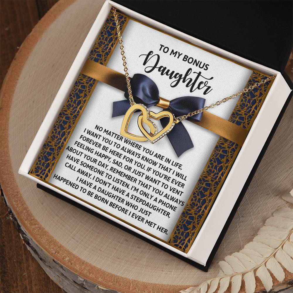Gift box containing the "Daughter-Have Someone" Interlocking Hearts Necklace crafted from surgical steel with a rose gold finish and cubic zirconia crystals, displayed on a printed card titled "To My Bonus Daughter.