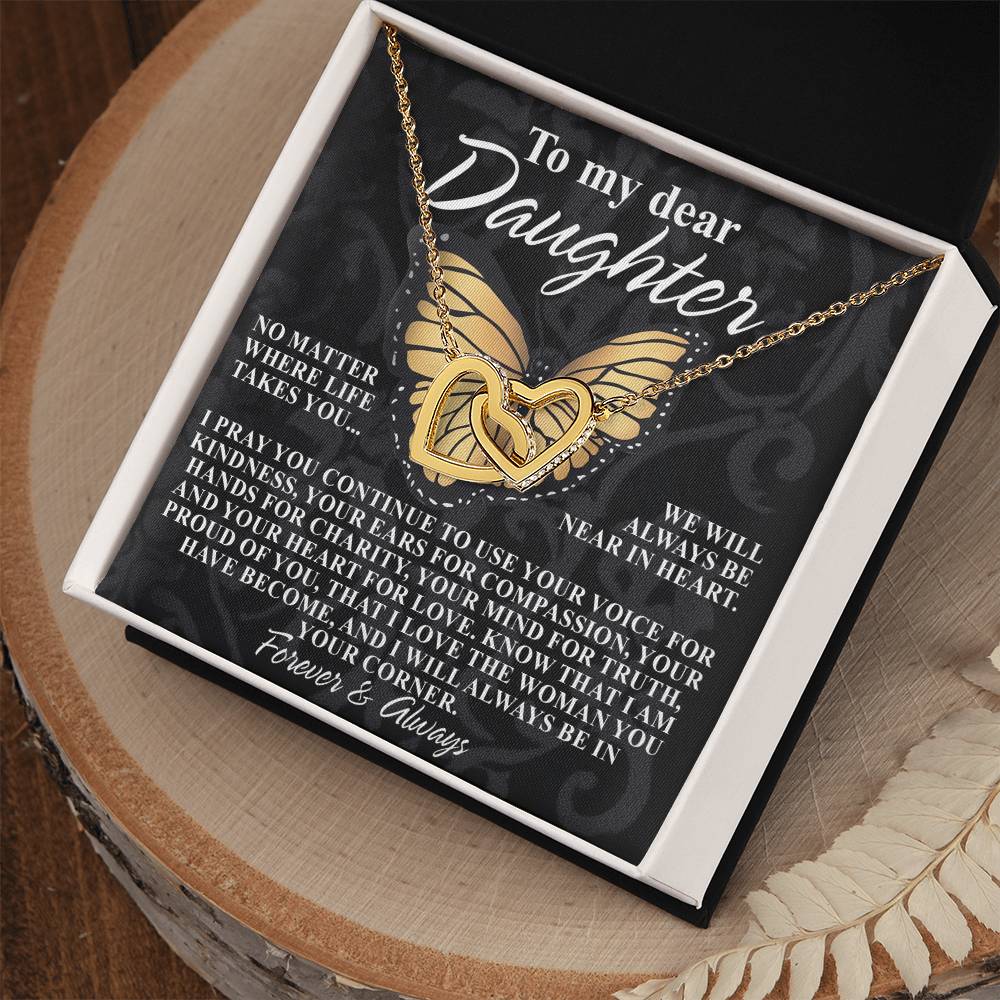 A gift box containing the "Daughter-In Your Corner - Interlocking Hearts Necklace" embellished with cubic zirconia comes with a card saying: "To my dear daughter, no matter where life takes you, I pray you continue to use your gift for kindness... I'm proud of you. Forever & always.