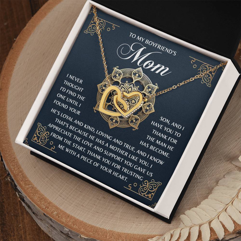 The "Mom-Thankful Heart" features an Interlocking Hearts necklace with sparkling cubic zirconia and a rose gold finish, presented in a gift box. The included card thanks a boyfriend's mom for raising such a wonderful son and entrusting the giver with part of her heart.