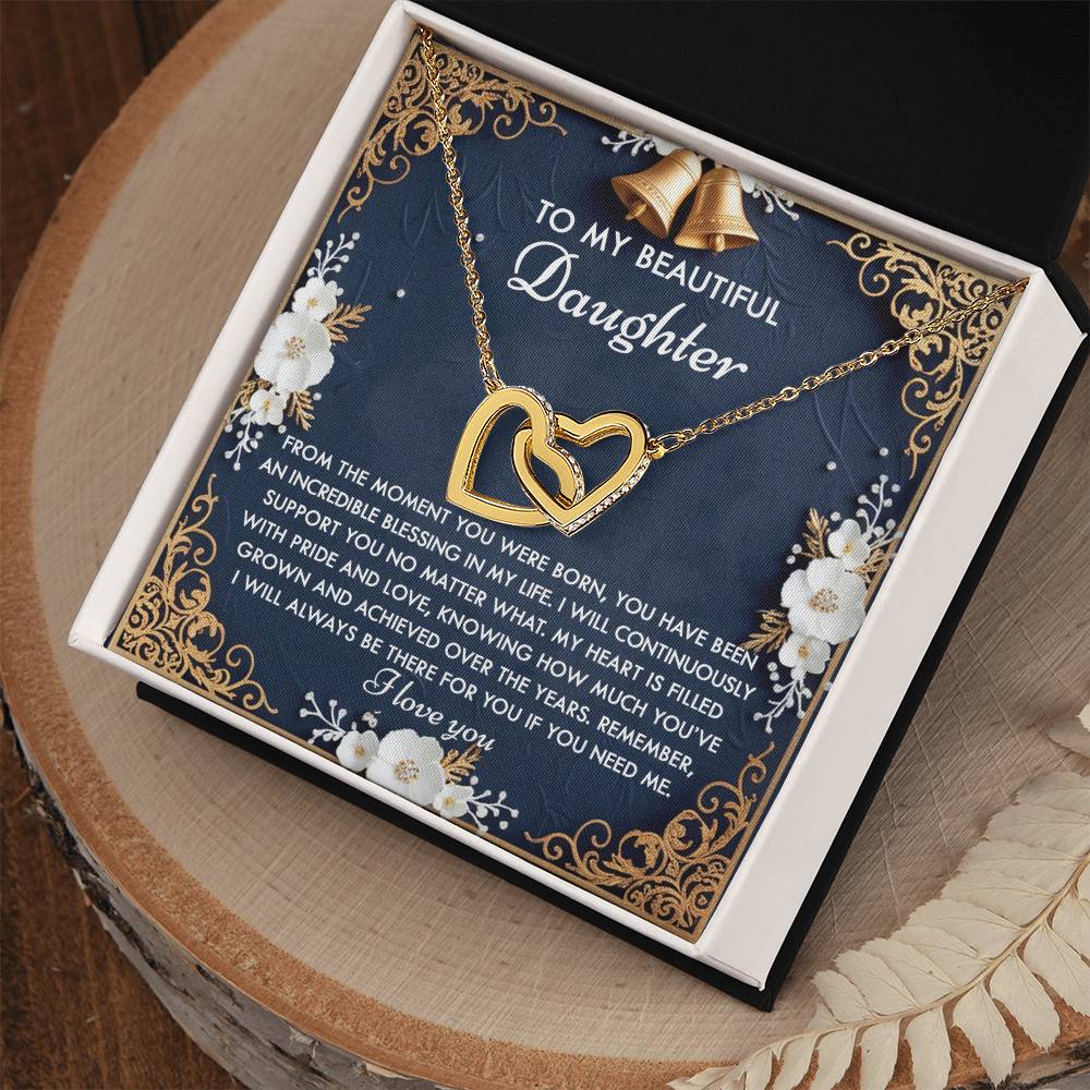 Gift box featuring a "Daughter-If You" necklace with interlocking hearts in rose gold, accompanied by a heartfelt message on a floral background.