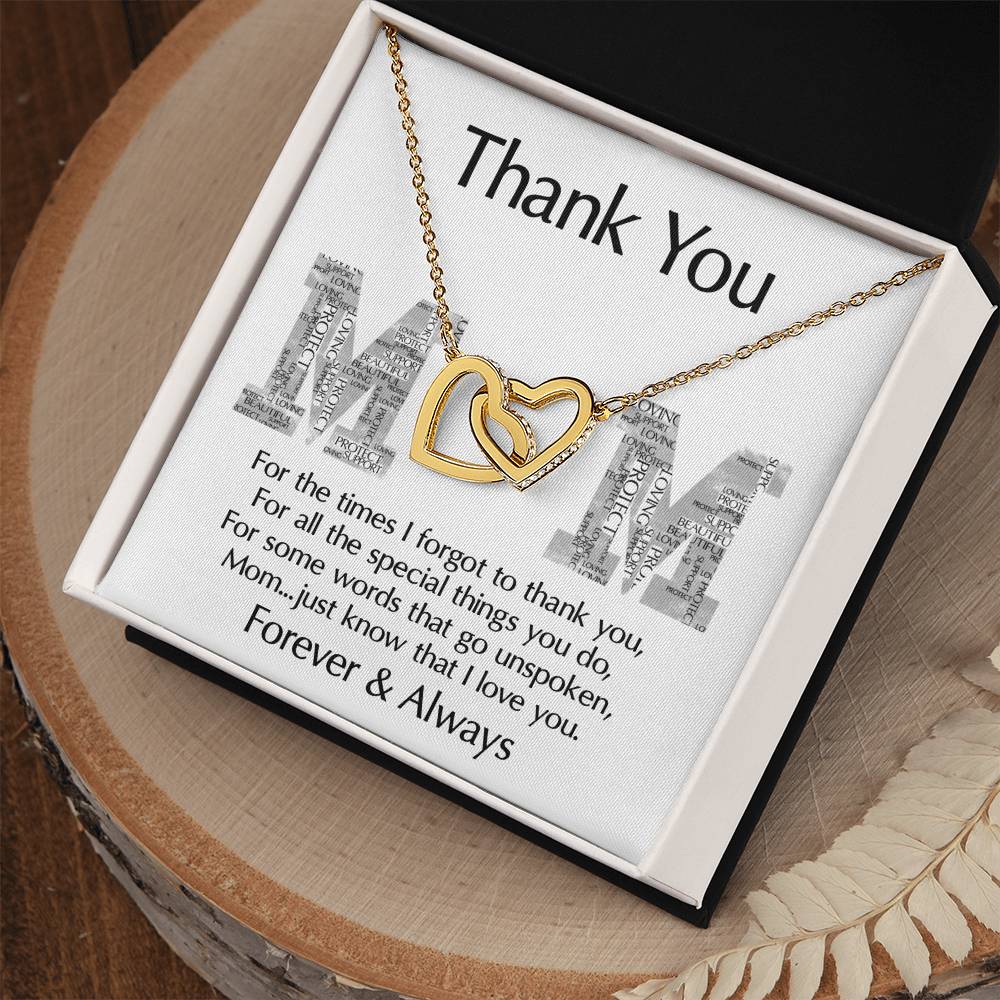 The "To Mom, Thank You - Interlocking Hearts Necklace" features sparkling cubic zirconia crystals in a box saying "Thank You Mom," with the heartfelt message "Forever & Always." This personalized gift is a timeless expression of gratitude and love.