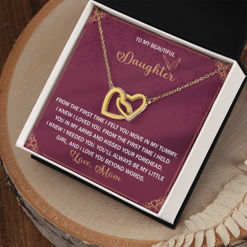 The Daughter-Beyond Words Interlocking Hearts Necklace features cubic zirconia crystals and a rose gold finish, presented in an open box with a card that reads: "To my beautiful daughter... Love, Mom," expressing love and cherished memories.