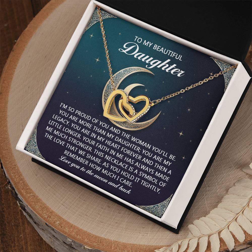 The Daughter-Hold It Tightly - Interlocking Hearts Necklace, adorned with cubic zirconia crystals and presented in a box, features the message "To my beautiful daughter" under a moon and stars, symbolizing her father's pride and love—a perfect gift highlighting deep care.