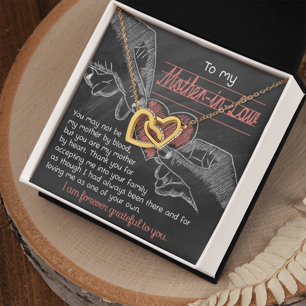 This unique "To Mother-In-Law, Mother By Heart" gold interlocking hearts necklace features cubic zirconia crystals and comes nestled in a black gift box with a heartfelt note of gratitude for your beloved mother-in-law.