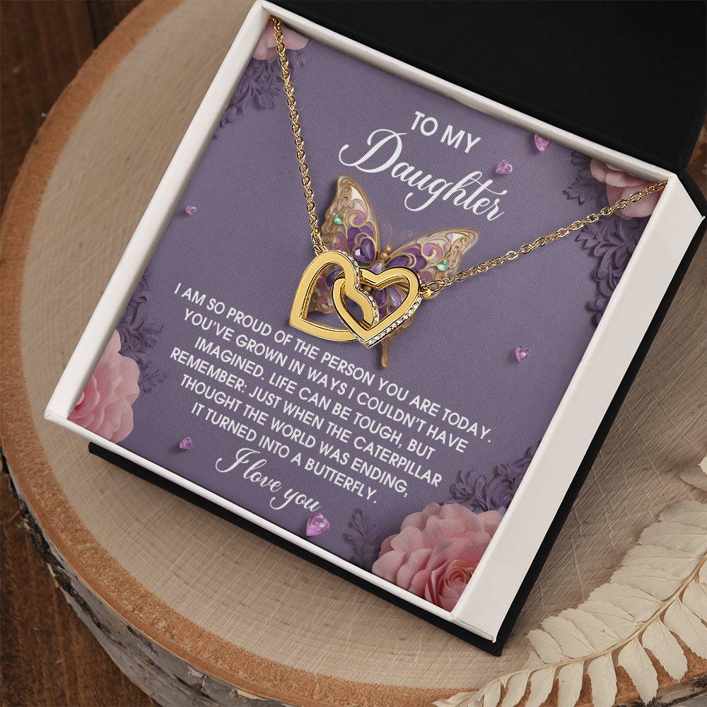 The Daughter-A Butterfly - Interlocking Hearts Necklace, in rose gold with cubic zirconia crystals, is presented in a box featuring a floral design and the heartfelt message "To My Daughter.