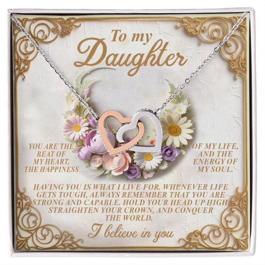 The Daughter-Heart Happiness necklace features silver interlocking heart pendants and is presented on a card decorated with flowers and a heartfelt message starting with "To my Daughter" and ending with "I believe in you.