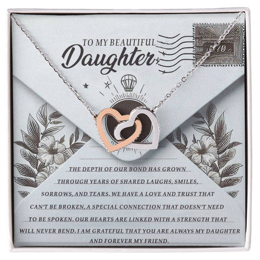 The Daughter-My Friend Interlocking Hearts Necklace, in silver and rose gold finish, rests on an envelope with "To My Beautiful Daughter." The backdrop features a heartfelt message about love and trust, framed by floral designs and enhanced with shimmering cubic zirconia crystals.