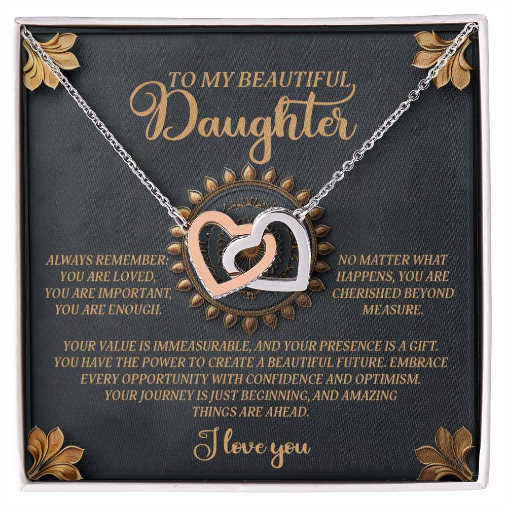 The Daughter-Beautiful Future - Interlocking Hearts Necklace features an 18k yellow gold finish, cubic zirconia crystals, and comes in a gift box inscribed with: "To my beautiful daughter, always remember: you are loved, you are important, you are enough," conveying value and optimism.