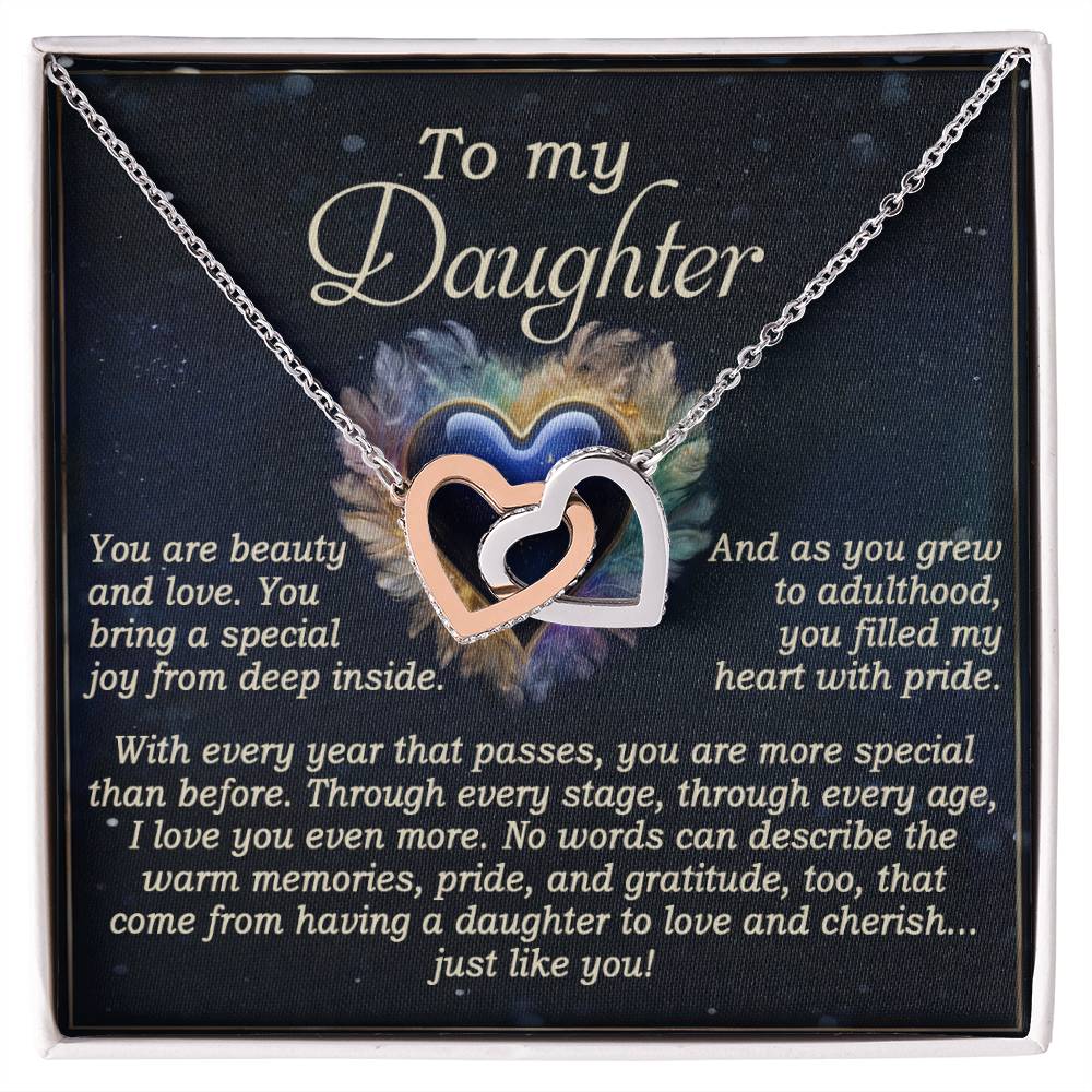 The Daughter-Like You - Interlocking Hearts Necklace features a rose gold finish and comes with a heartfelt card reading, "To my Daughter. You are beauty and love... Through every stage... you filled my heart with pride... No words can describe the warm memories... cherish... just like you.