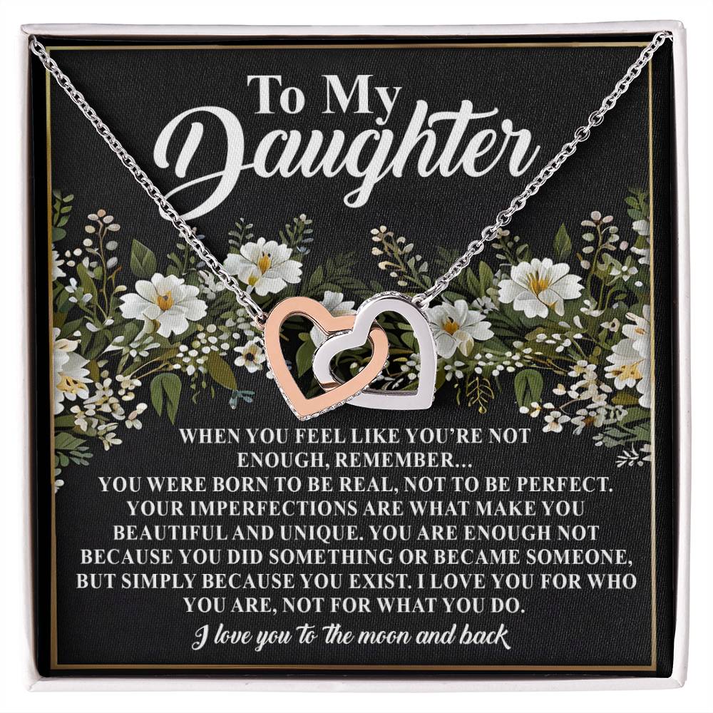 The Daughter-What You Do - Interlocking Hearts Necklace is beautifully presented on a floral black card inscribed with "To My Daughter" and a touching message on beauty, value, and love.