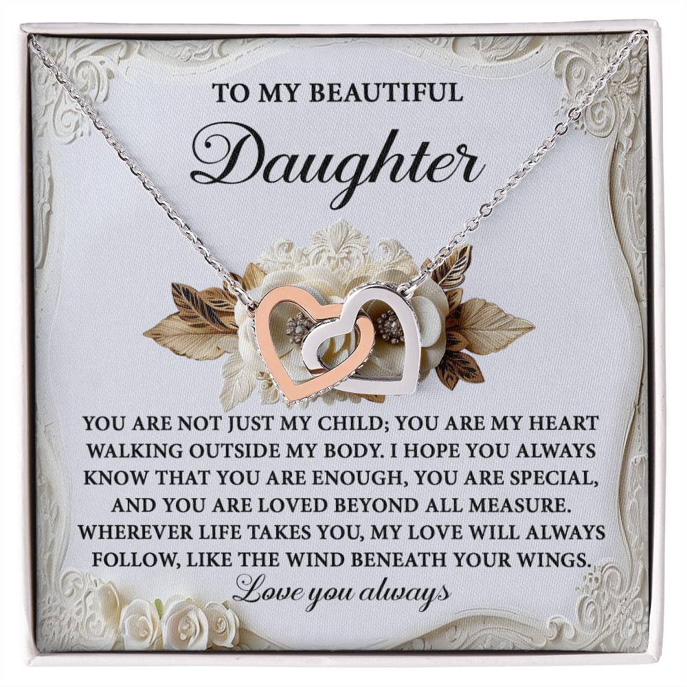 The Daughter-Beneath Your Wings Interlocking Hearts Necklace, shimmering with cubic zirconia crystals and finished in radiant rose gold, is beautifully presented in a box with floral accents and a heartfelt message to a daughter.