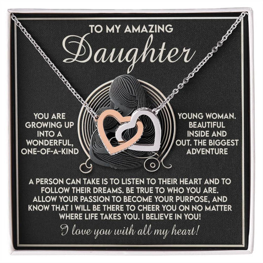 The Daughter-Your Dreams Interlocking Hearts Necklace features rose gold and silver-tone hearts embellished with cubic zirconia crystals, beautifully arranged in a gift box that contains an inspirational message for a daughter to pursue her dreams and remain authentic.