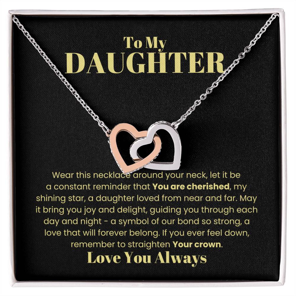 This "To My Daughter" necklace box, featuring an Interlocking Hearts Necklace with sparkling cubic zirconia crystals, includes a heartfelt message about everlasting love and guidance, making it a sentimental gift she'll cherish forever.