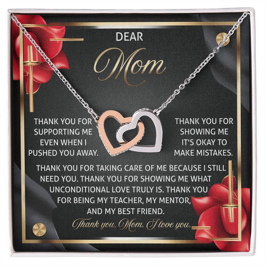 A gift box featuring the "Mom-Best Friend 2 - Interlocking Hearts Necklace" with cubic zirconia crystals in a rose gold finish and a card saying, "Dear Mom, thank you for supporting me... showing me unconditional love... being my teacher, my mentor, and my best friend.