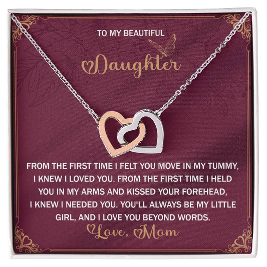 The Daughter-Beyond Words - Interlocking Hearts Necklace, featuring cubic zirconia crystals, is presented on a heartfelt message card from mom to daughter—making it the perfect gift for her.