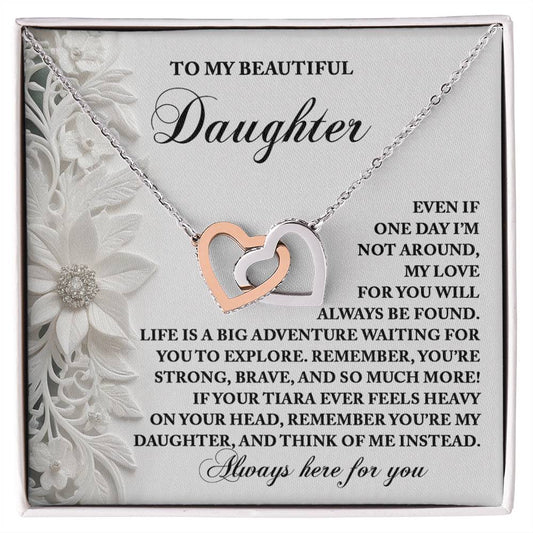 The Daughter-Think Of Me - Interlocking Hearts Necklace on a decorative card, with a rose gold finish and sparkling cubic zirconia crystals, conveys a heartfelt message to your daughter, celebrating love, support, and life's exciting adventures.
