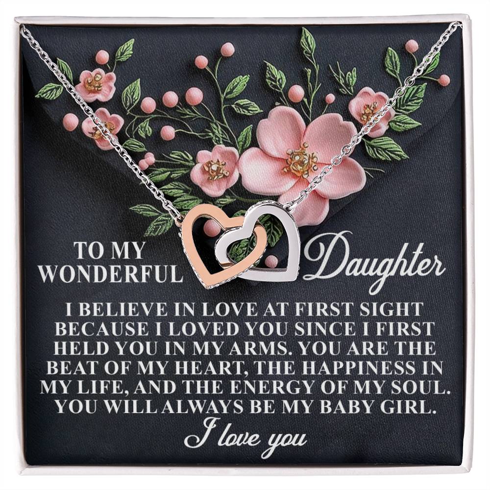 Silver interlocking Hearts necklace adorned with cubic zirconia crystals features a heartfelt message: "To my wonderful daughter. I believe in love at first sight... You will always be my baby girl. I love you.