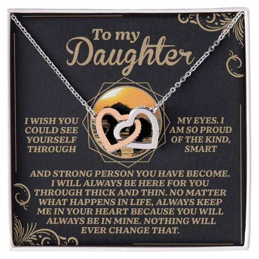 The Daughter-Proud Heart Interlocking Hearts Necklace, with a rose gold finish and cubic zirconia crystals, comes on a card that reads: "To my Daughter. I wish you could see yourself through my eyes. I am so proud of the kind, smart, and strong person you have become. You will always be in mine—nothing will ever change that.