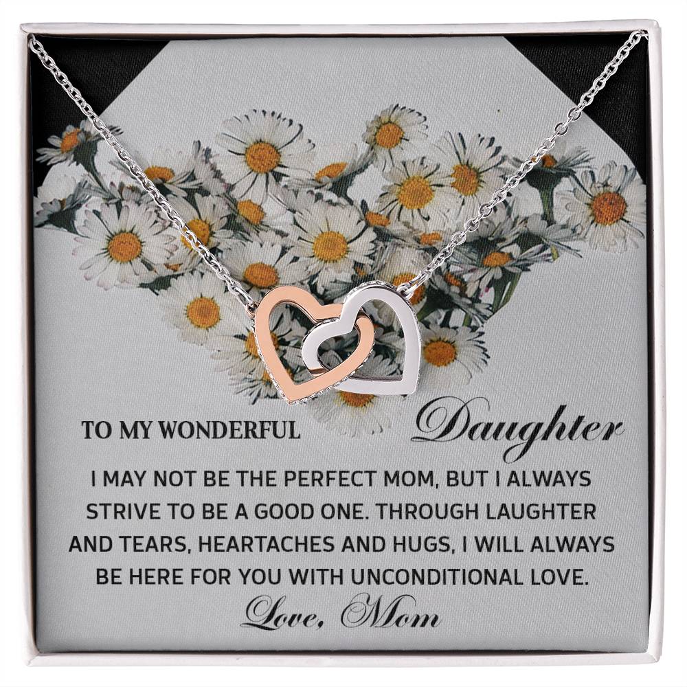 The Daughter-Unconditional Love necklace features interlocking hearts in a rose gold finish with cubic zirconia crystals, set against a floral background to symbolize the cherished bond and unconditional love between a mother and daughter.