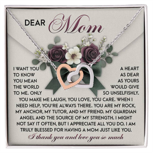The "Mom-Guardian Angel - Interlocking Hearts Necklace" features a surgical steel necklace with cubic zirconia crystals on a decorative card. The card begins with "Dear Mom," expressing love, gratitude, and appreciation for her support and selflessness.