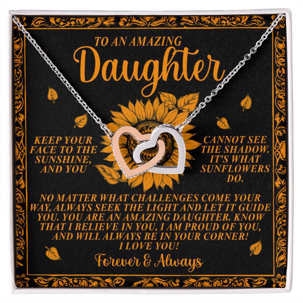 Discover the "Daughter-Seek Light - Interlocking Hearts Necklace," featuring cubic zirconia crystals on a sunflower-themed card with the message: "To an amazing daughter...No matter what challenges come your way, always seek the light...I love you! Forever & Always." An ideal gift to cherish.