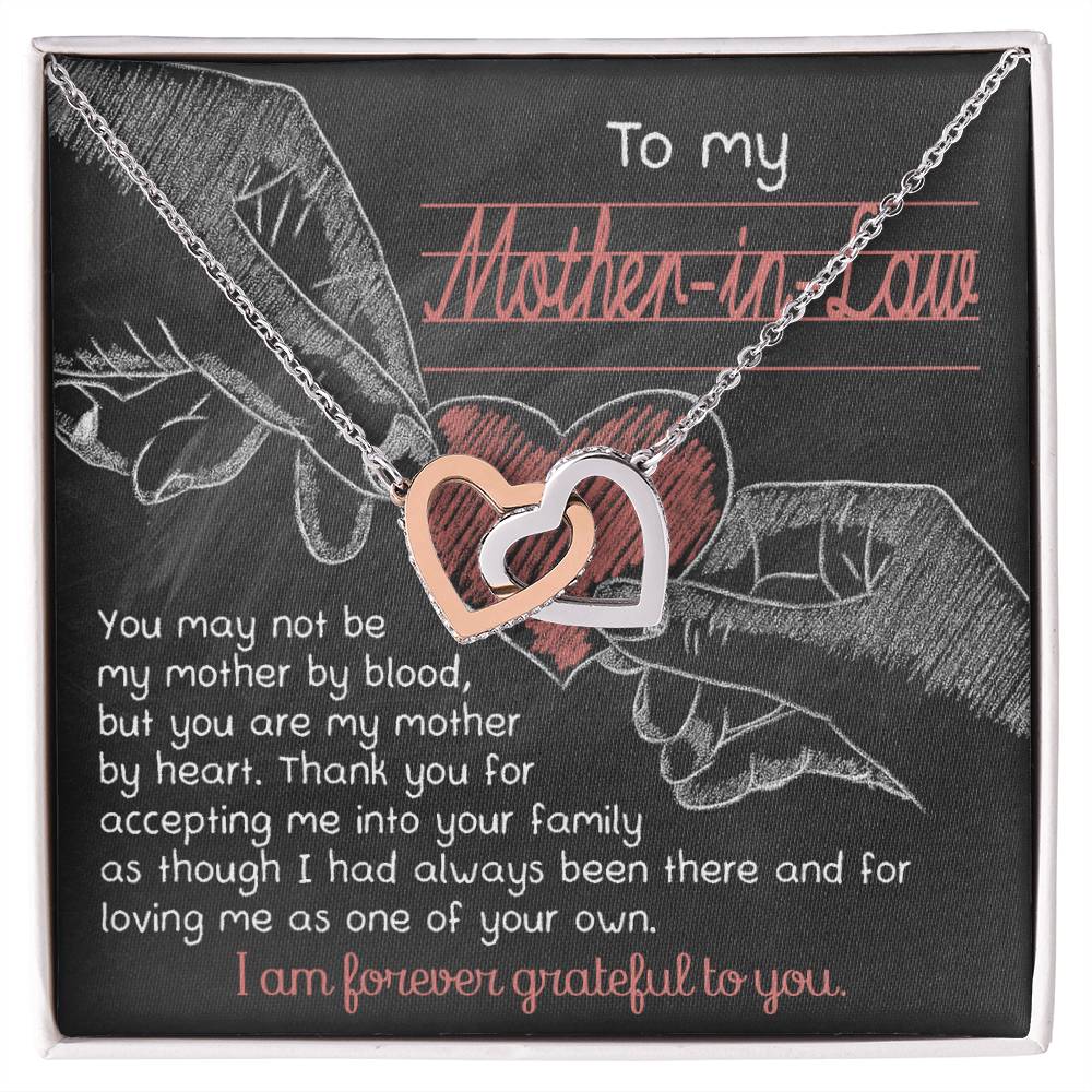 A chalkboard-themed graphic with two hands forming a heart, accompanied by a To Mother-In-Law, Mother By Heart - Interlocking Hearts Necklace and a loving message to a mother-in-law.