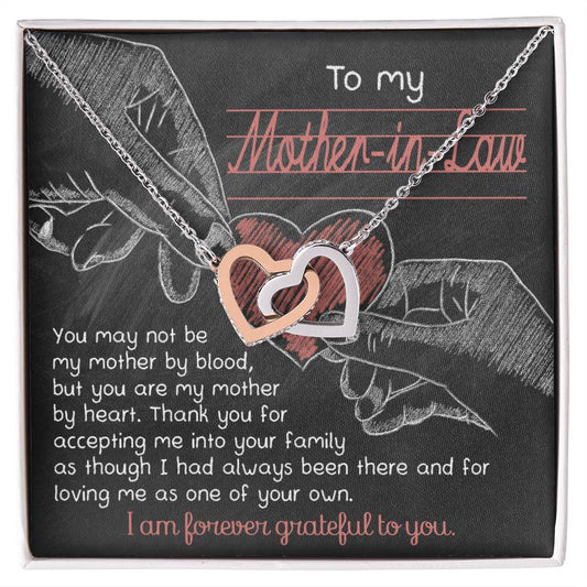 A chalkboard-themed graphic with two hands forming a heart, accompanied by a To Mother-In-Law, Mother By Heart - Interlocking Hearts Necklace and a loving message to a mother-in-law.