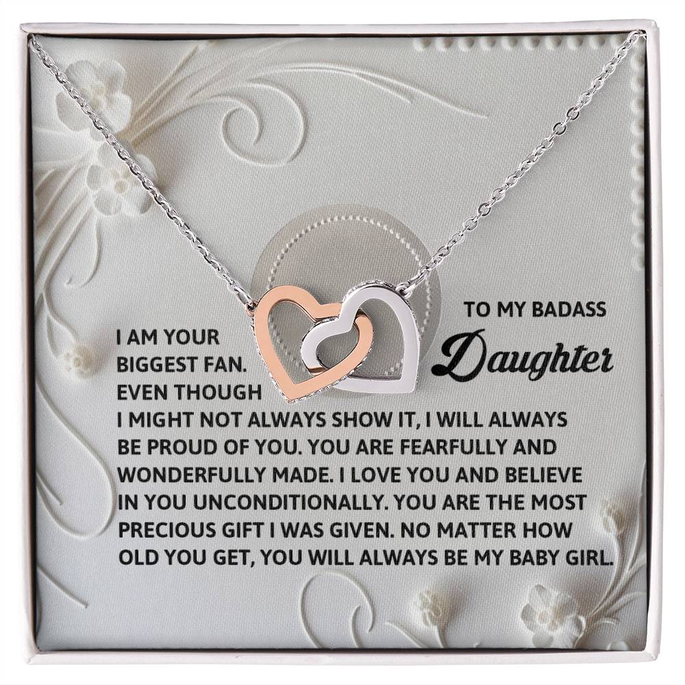 The Daughter-My Baby Girl Interlocking Hearts Necklace, finished in radiant rose gold, features two hearts embellished with cubic zirconia crystals. It captures the parent-daughter bond and includes an inspirational message card for a special touch.