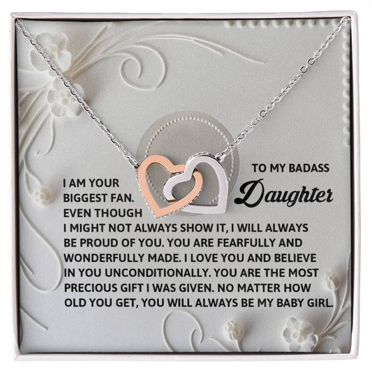The Daughter-My Baby Girl Interlocking Hearts Necklace, finished in radiant rose gold, features two hearts embellished with cubic zirconia crystals. It captures the parent-daughter bond and includes an inspirational message card for a special touch.