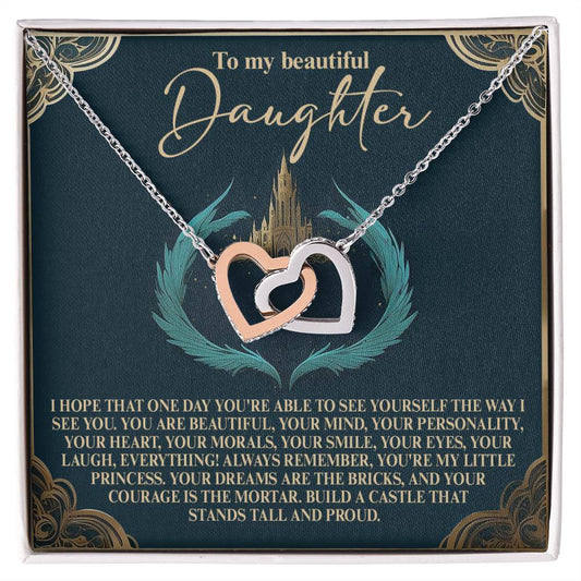 The jewelry box presents the Daughter-Little Princess - Interlocking Hearts Necklace with two heart pendants, one silver and one rose gold, accented by cubic zirconia crystals. It includes a heartfelt message for a daughter appreciating her qualities and encouraging self-belief.