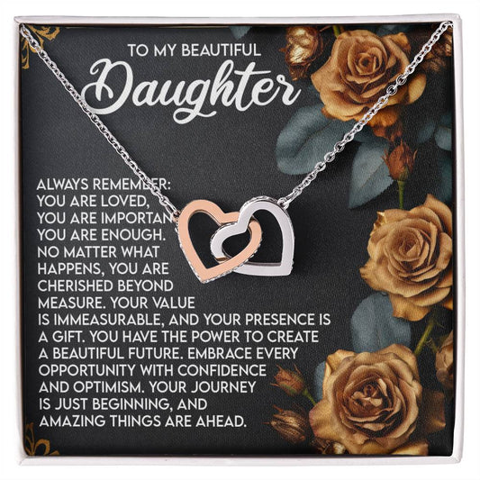 The Daughter-Loved Enough - Interlocking Hearts Necklace has a rose gold finish and is presented on a heartfelt message card to a daughter, encircled by golden roses, conveying love and encouragement.