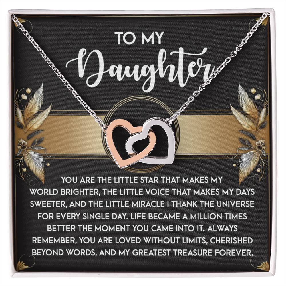The Daughter-Greatest Treasure - Interlocking Hearts Necklace is adorned with cubic zirconia crystals and elegantly displayed on a card featuring a heartfelt message to a daughter, with floral accents and decorative text.