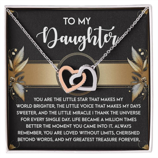 The Daughter-Greatest Treasure - Interlocking Hearts Necklace is adorned with cubic zirconia crystals and elegantly displayed on a card featuring a heartfelt message to a daughter, with floral accents and decorative text.