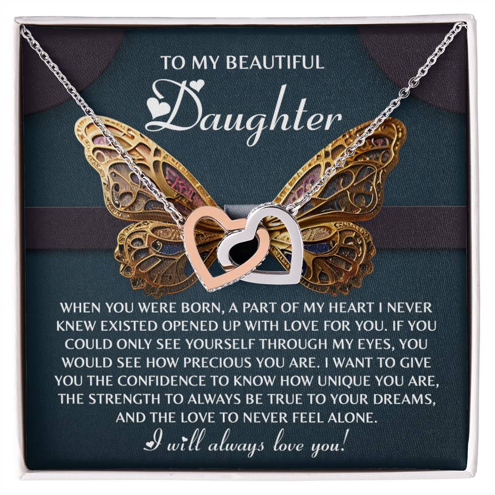 The Daughter-Never Feel Alone - Interlocking Hearts Necklace showcases interlocking hearts against a butterfly wing design, adorned with cubic zirconia crystals and a touching message for your daughter.