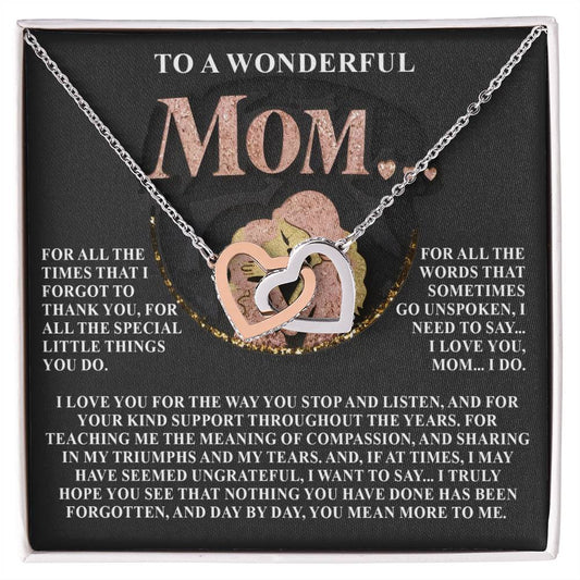 The Mom-More To Me 2 Interlocking Hearts Necklace features a rose gold finish with cubic zirconia crystals, presented on a card. It conveys love and gratitude to a mother for her support, compassion, and cherished moments.