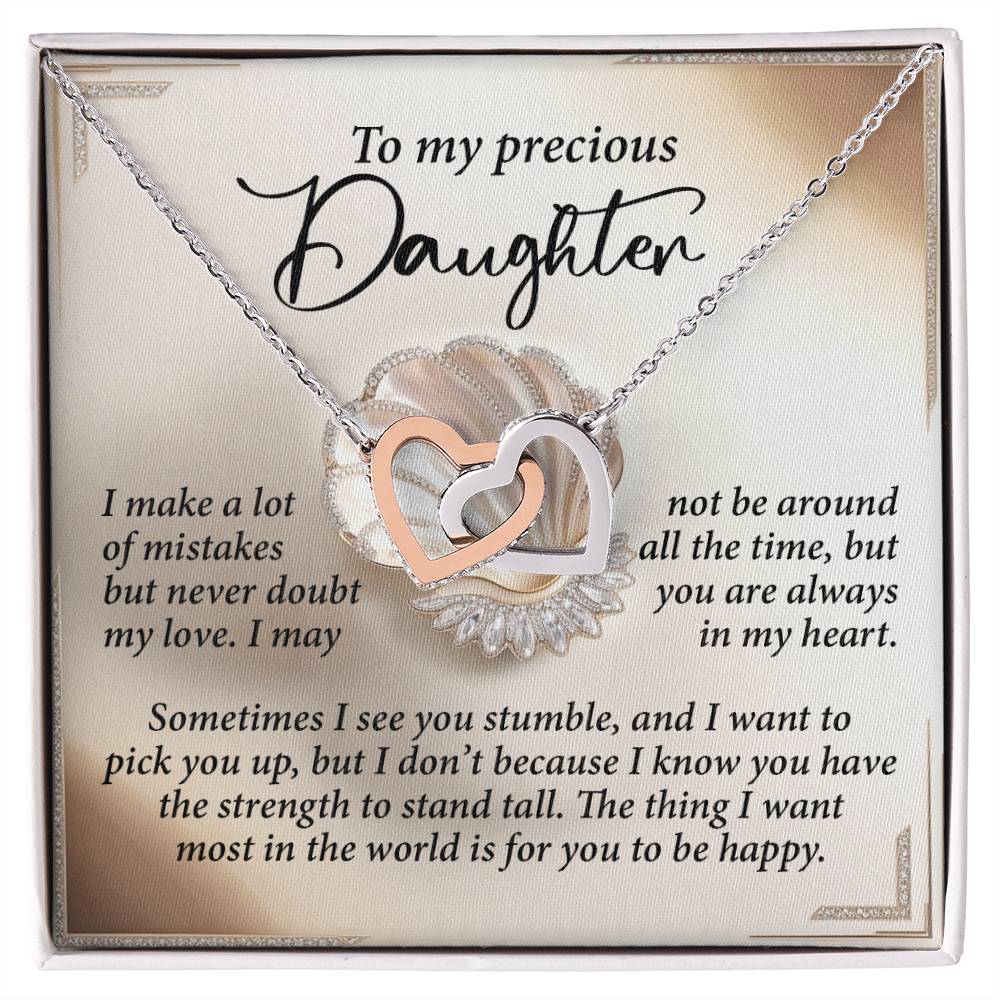 The Daughter-Be Happy - Interlocking Hearts Necklace features a silver and rose gold finish with cubic zirconia crystals, presented on a decorative card conveying an emotional message to a daughter about love, support, and happiness.