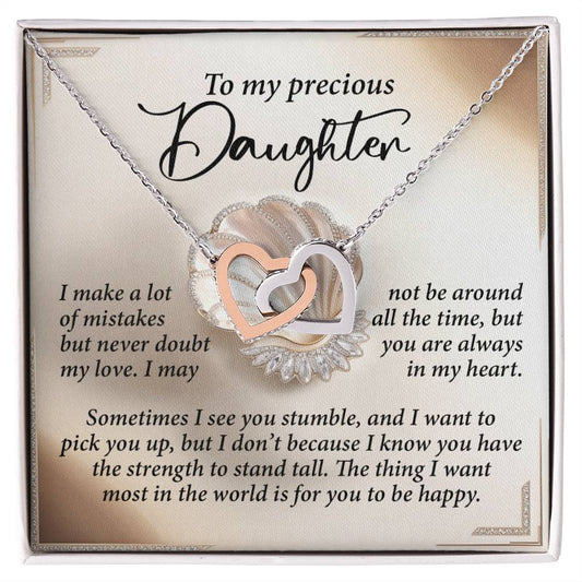 The Daughter-Be Happy - Interlocking Hearts Necklace features a silver and rose gold finish with cubic zirconia crystals, presented on a decorative card conveying an emotional message to a daughter about love, support, and happiness.