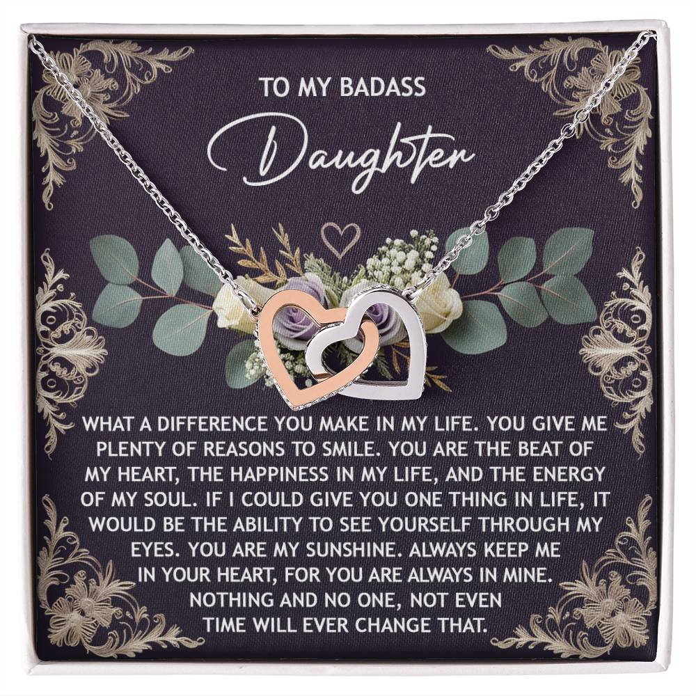 The Daughter-Always In Mine - Interlocking Hearts Necklace features shimmering cubic zirconia crystals and a rose gold finish, presented on a floral card with a heartfelt message to your daughter.