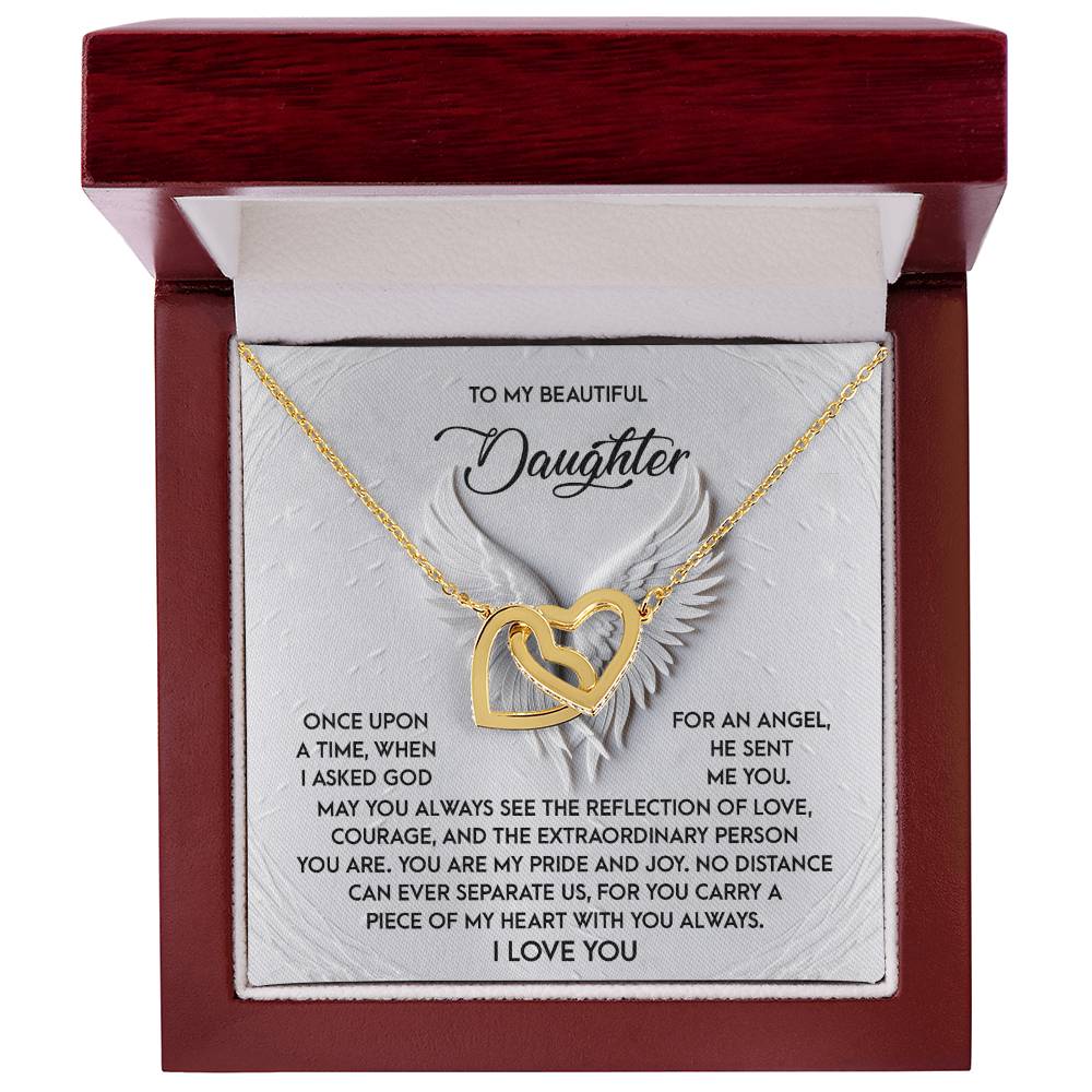 The Daughter-An Angel - Interlocking Hearts Necklace features cubic zirconia crystals on surgical steel with a rose gold finish, presented in a red box. Its inner lid holds a heartfelt message for a daughter, surrounded by delicate wing illustrations.