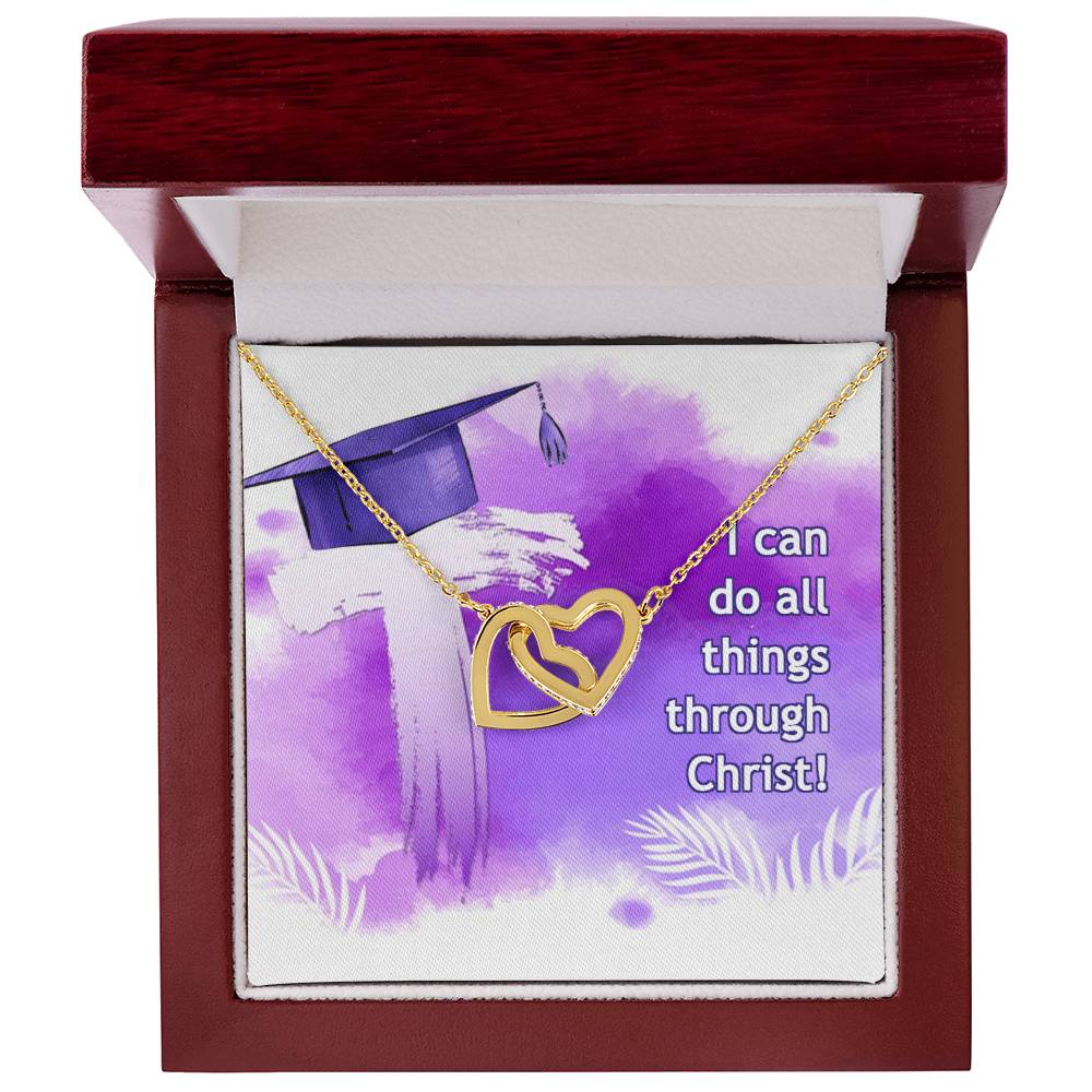 A I can do all things through Christ - Interlocking Hearts Necklace presented in a box with a graduation cap illustration and the inscription "I can do all things through Christ! by ShineOn Fulfillment.