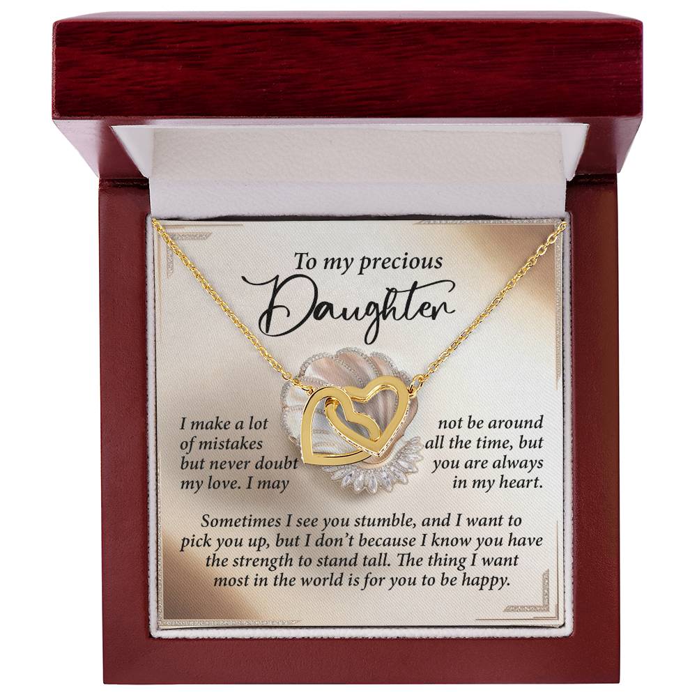 The Daughter-Be Happy - Interlocking Hearts Necklace, adorned with sparkling cubic zirconia crystals in gold and silver hues, features an 18k yellow gold finish. Presented in a red box with the message "To my precious Daughter," it conveys love and support.