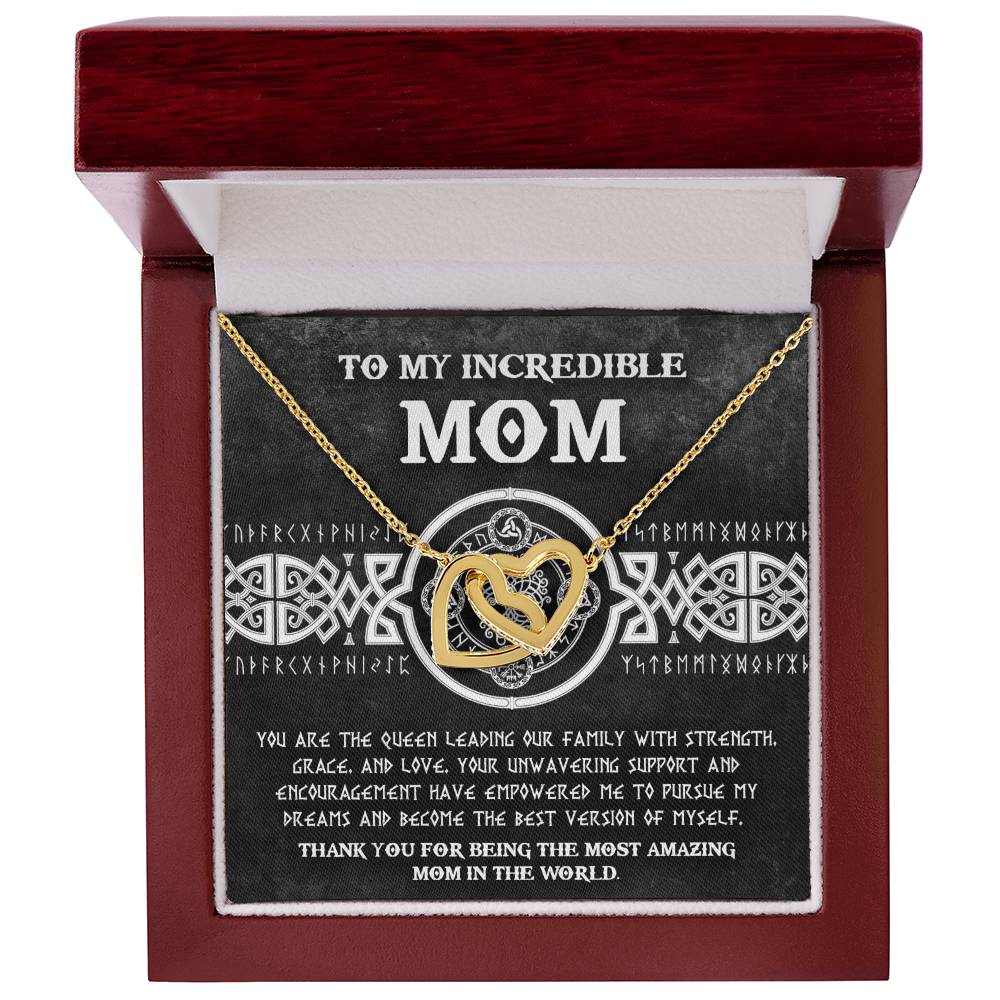 The "To Mom, The Queen 2" Interlocking Hearts Necklace is a heartfelt gift with sparkling cubic zirconia crystals. Nestled in a beautiful box, it carries a touching message to "Mom," making it the perfect token of love and appreciation.