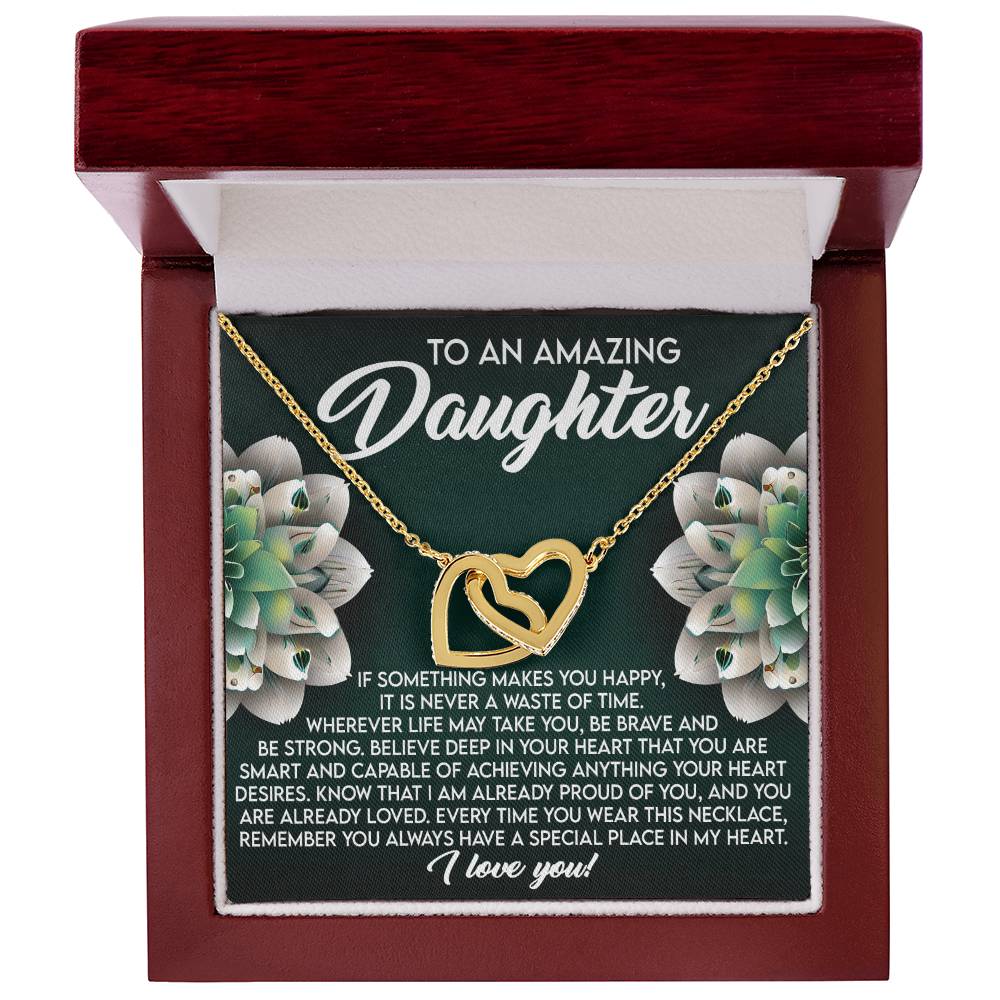 The Daughter-Special Place - Interlocking Hearts Necklace, featuring cubic zirconia crystals and a rose gold finish, is encased in a polished wooden box with the message, "To an Amazing Daughter," offering heartfelt encouragement on happiness and love, reminding her she is cherished always.